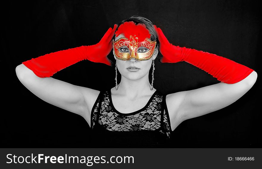 Portrait of beautiful young woman wearing red italian glowes and mask. Portrait of beautiful young woman wearing red italian glowes and mask.