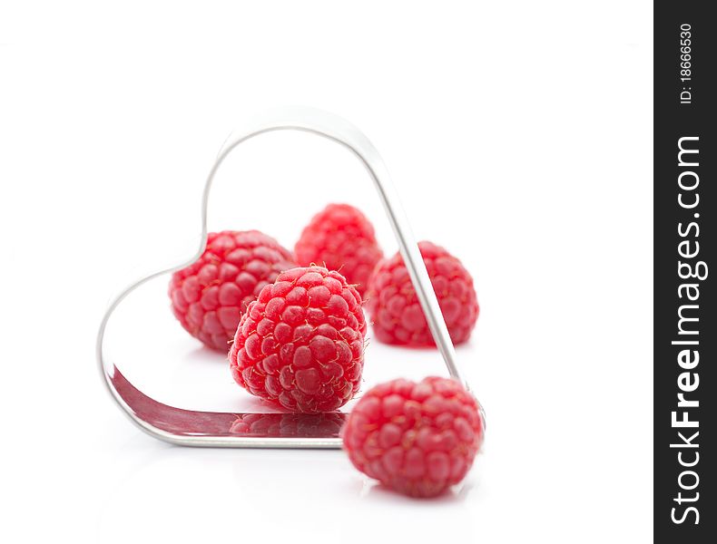 Fresh raspberries with metallic heart (easy removable text)