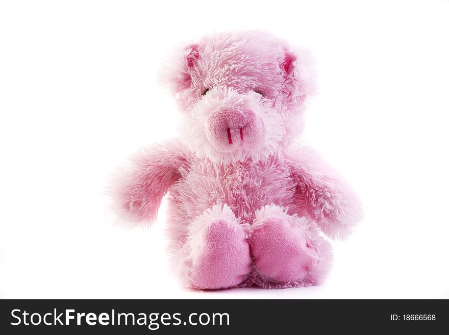 A pink fluffy toy pig isolated on a white background. A pink fluffy toy pig isolated on a white background