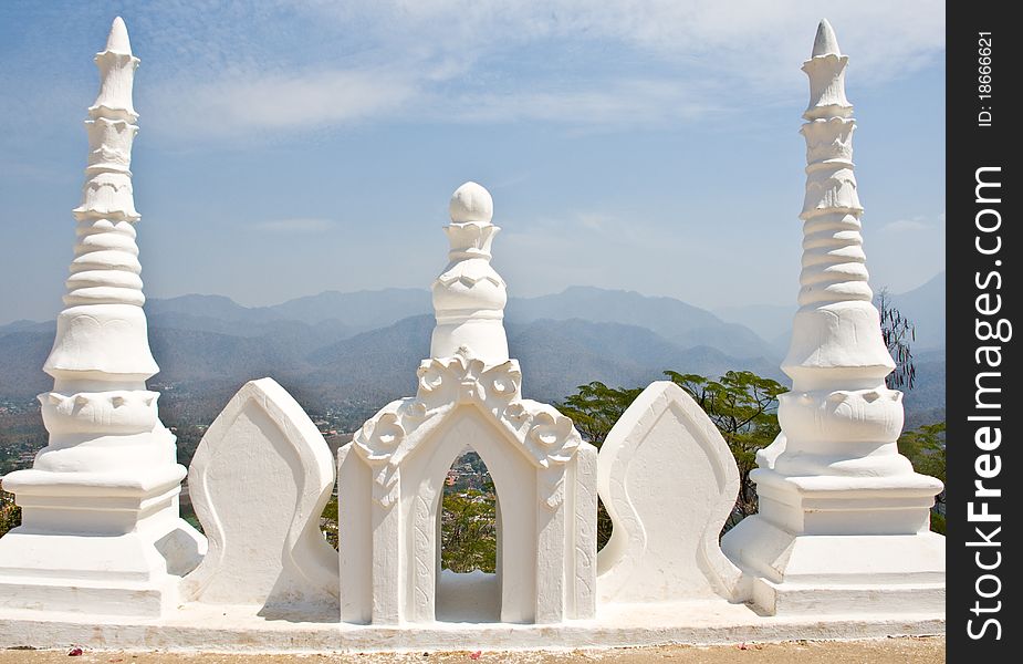 Three Tops Of White Pagoda With Blue Sky