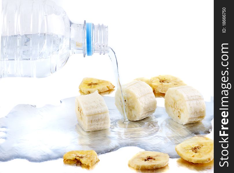 Dried bananas being rehydrated by water. Dried bananas being rehydrated by water