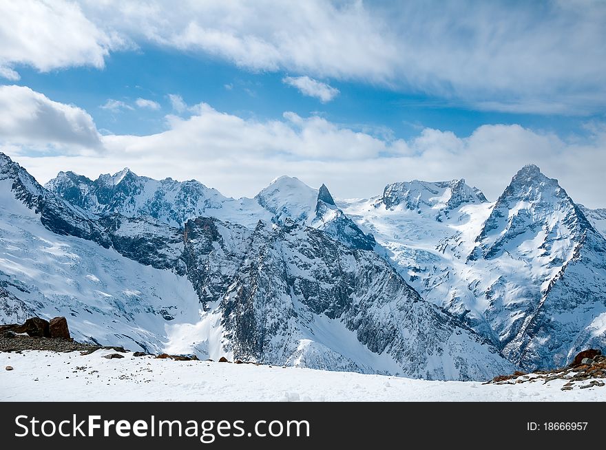 Snow-covered tops of the Caucasian mountains in Russia. Snow-covered tops of the Caucasian mountains in Russia.