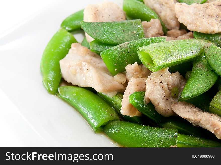 Fried pea and pork thai style with powdered pepper