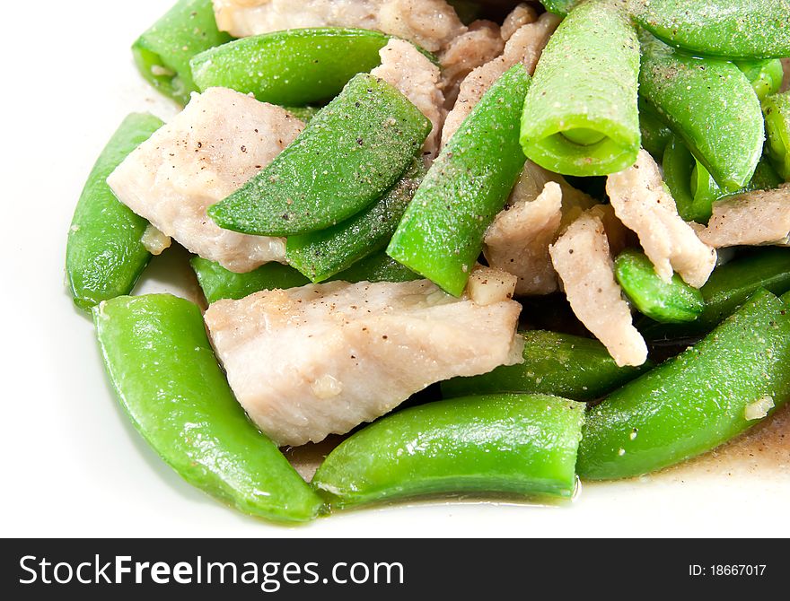 Fried pea and pork thai style with powdered pepper