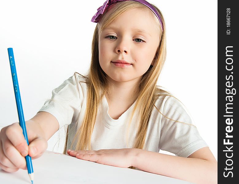 Adorable little girl drawing artwork. Studio shot