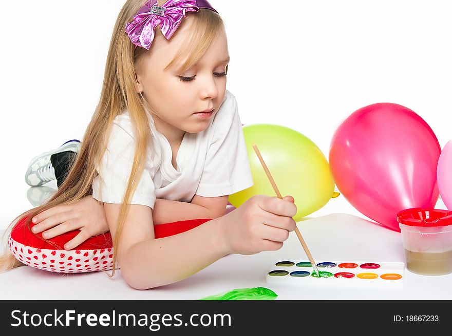 Adorable little girl drawing artwork. Studio shot