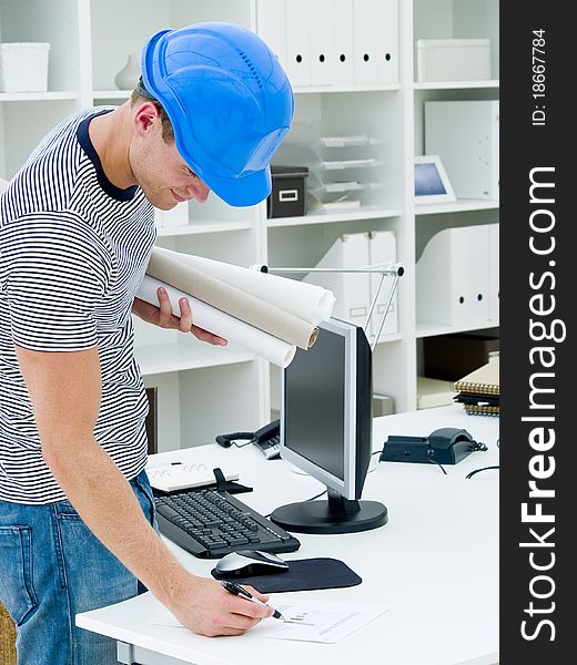 Construction worker looking at the diagrams and blueprints