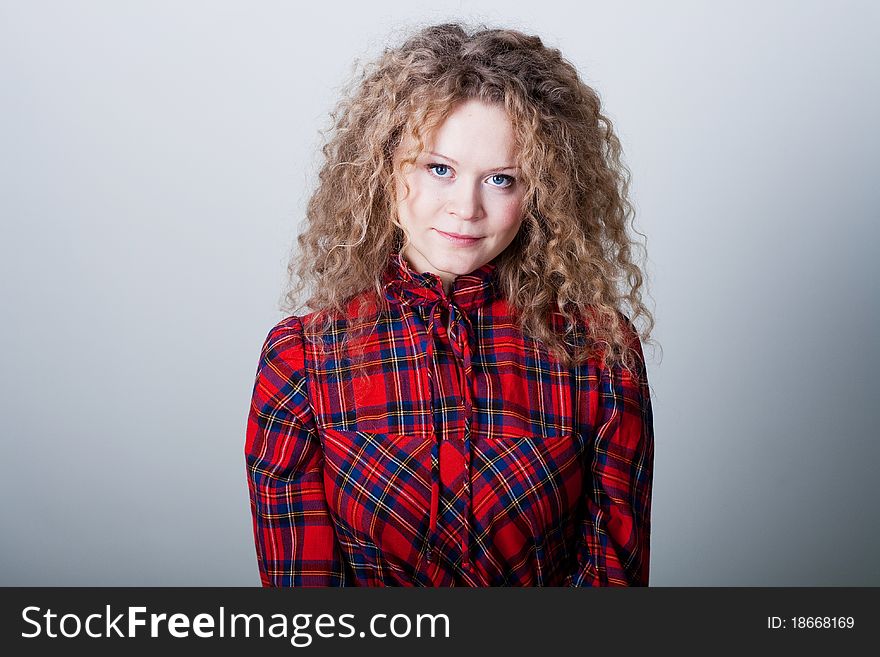 Portrait of beauty woman with blonde curly hairs with blue eyes