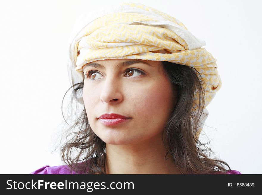 Beautiful arabic woman wearing an yellow turban on her head