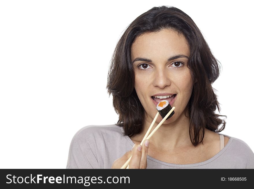 Woman eats sushi on whire background. Woman eats sushi on whire background