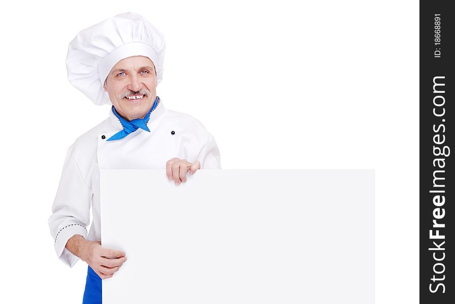Senior chef in white uniform with blank sign, studio shot