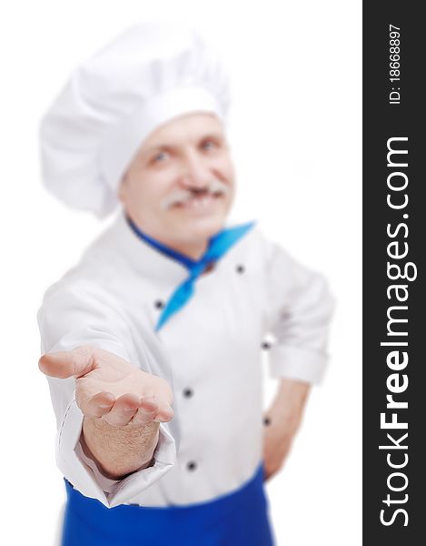 Senior chef in white uniform making a gesture with his hand. Senior chef in white uniform making a gesture with his hand