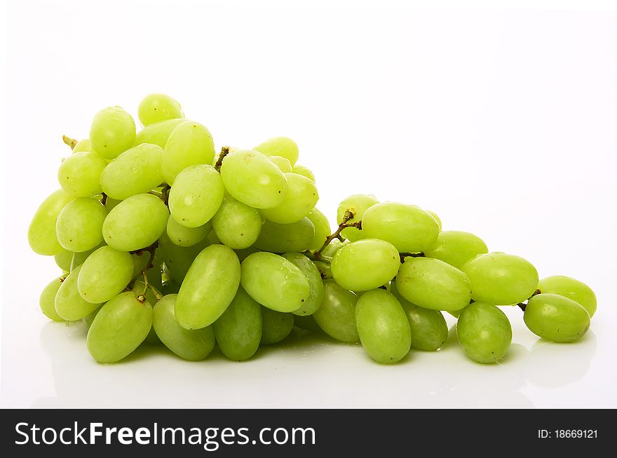 Fresh green grapes. Isolated on white background. Fresh green grapes. Isolated on white background