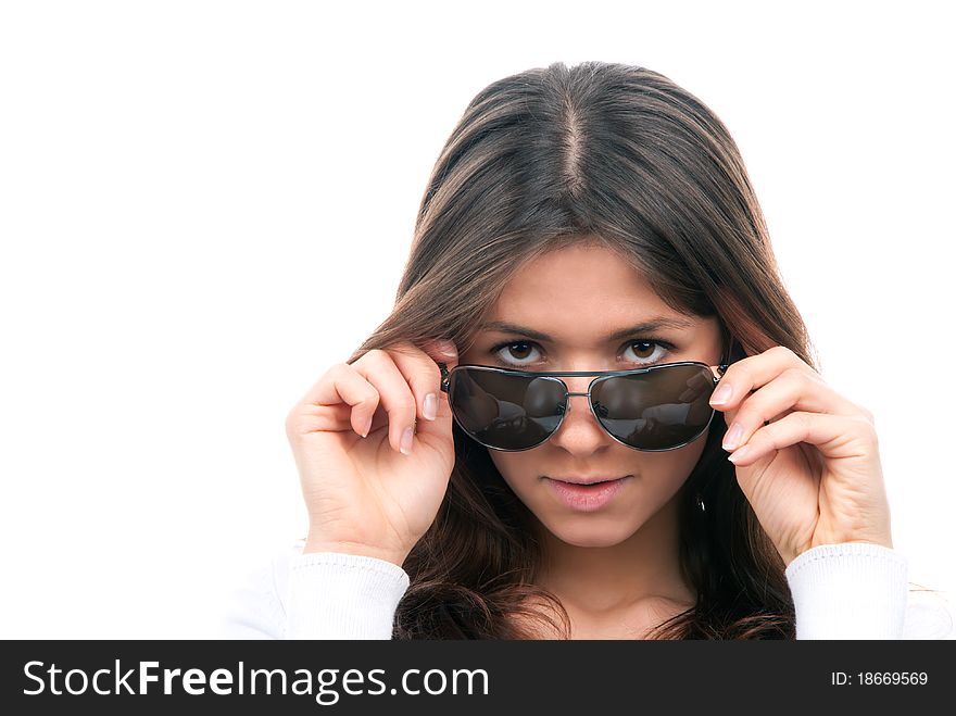 Beautiful fashion woman wearing off sunglasses isolated on a white background