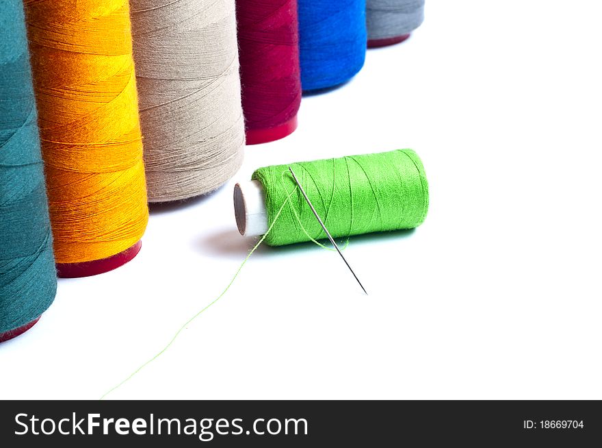 Spools of thread on white background
