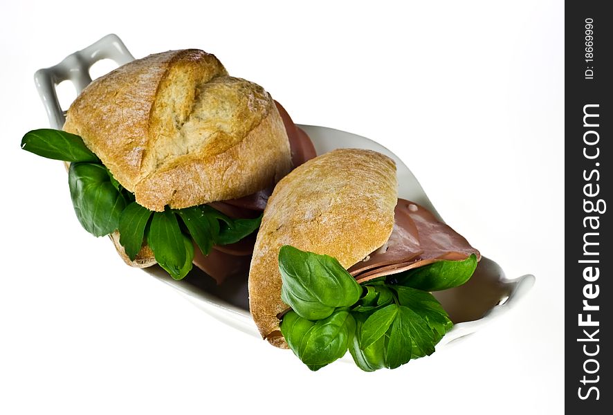 Ciabatta bread rolls with mortadella and basil