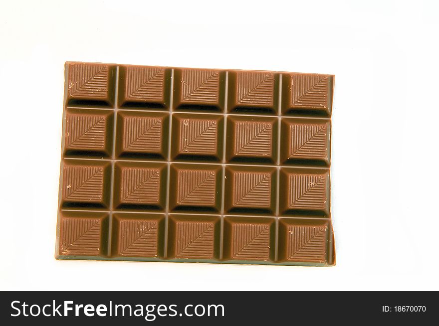 A piec of chocolate isolated on a white background