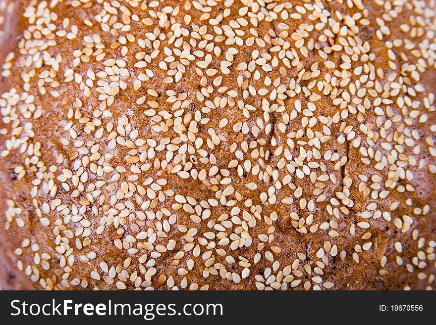 Round bread with sesame seeds, background. Round bread with sesame seeds, background