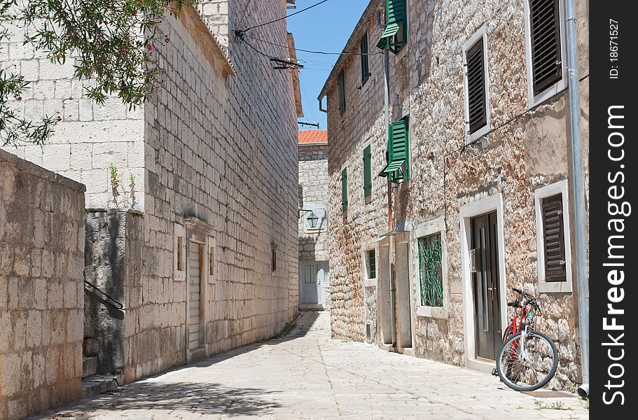 A city view of the croatian city of stari grad on the island of hvar in the adriatic sea. A city view of the croatian city of stari grad on the island of hvar in the adriatic sea