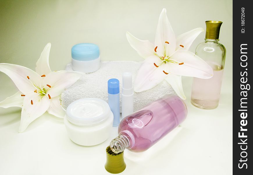 Spa hair mask creme liquid soap candles towel essences and white lily. Spa hair mask creme liquid soap candles towel essences and white lily