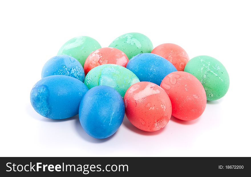 A dozen hand painted colorful easter eggs isolated over white. A dozen hand painted colorful easter eggs isolated over white