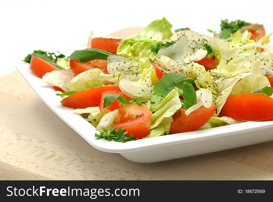 Dish tomatos salad with fresh herbs. Dish tomatos salad with fresh herbs