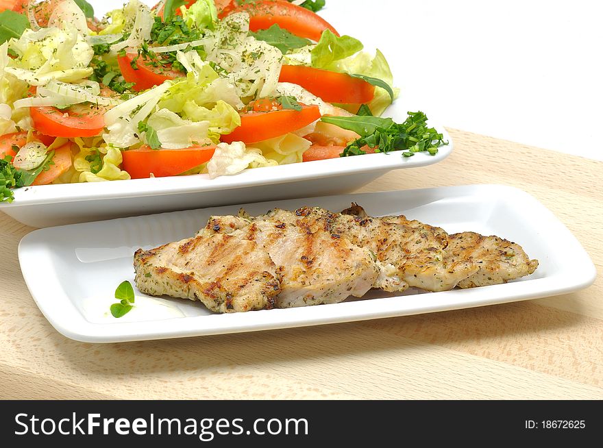Grilled turkey tenderloin with a salad of fresh tomatoes