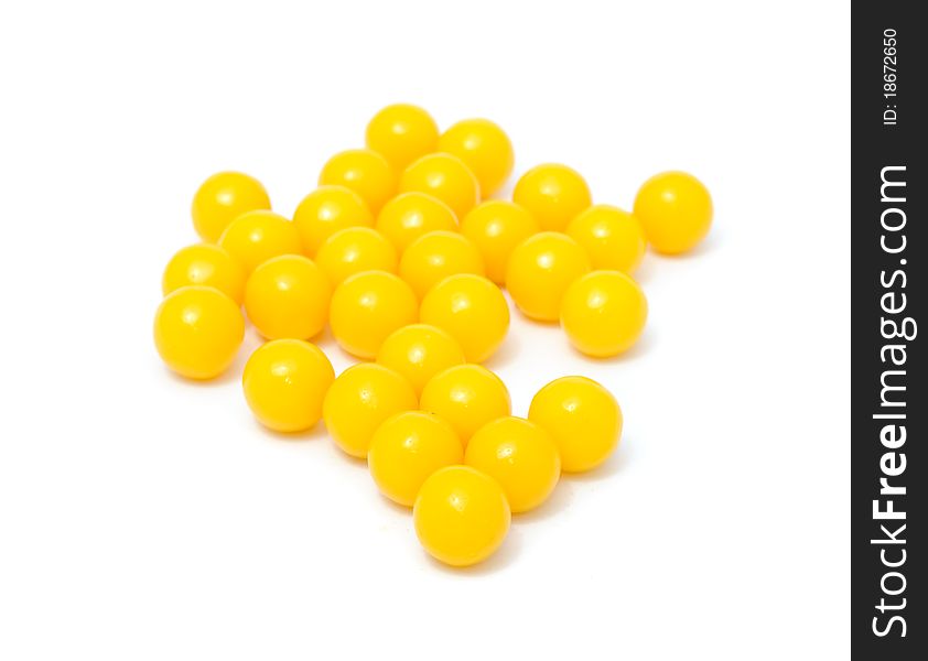 A pile of vitamin pills isolated on a white background