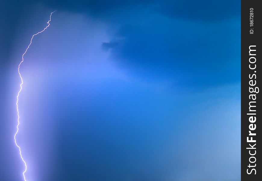 Lightning in blue sky during rain. Lightning in blue sky during rain