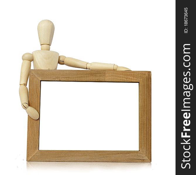 Wooden concept of mannequin in pose with wood frame. Wooden concept of mannequin in pose with wood frame