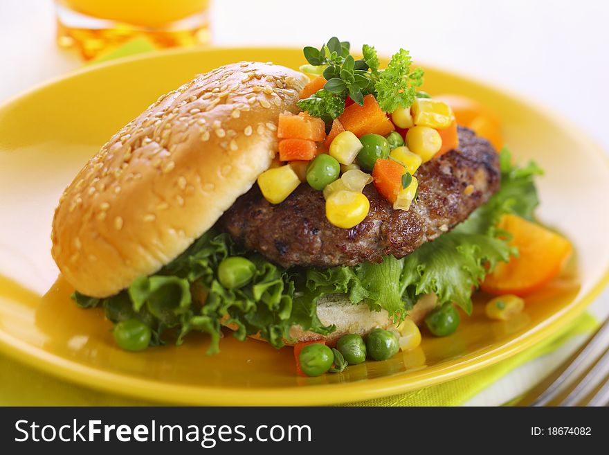 Hamburger with vegetables close up