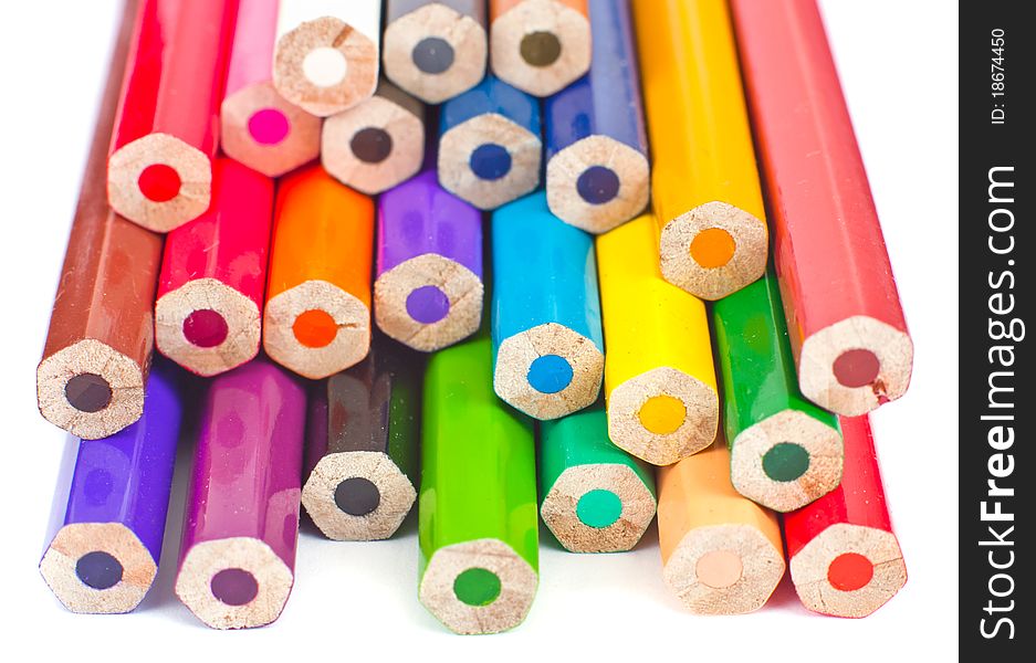 Colour pencils isolated on white background close up. Focus on the middle