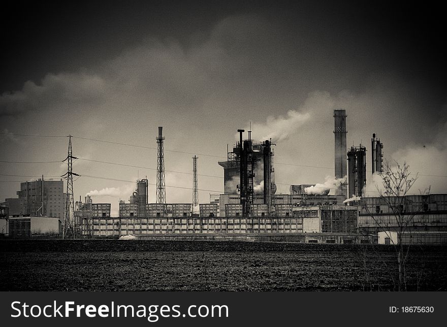 Smoke coming out of old factory chimney - noise added for effect