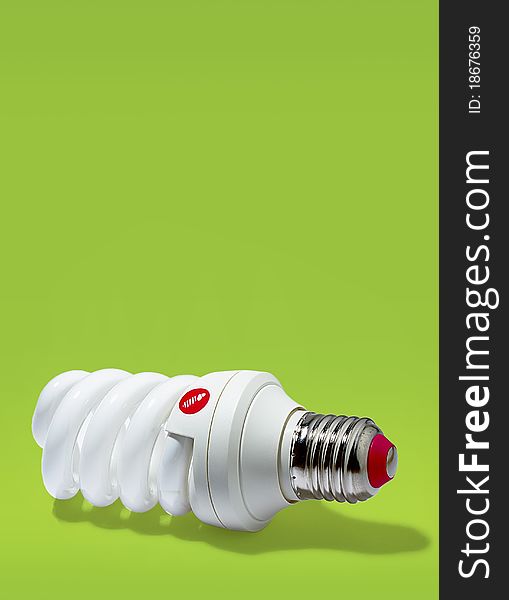 Electric energy saving light bulbs on a green background. Electric energy saving light bulbs on a green background.
