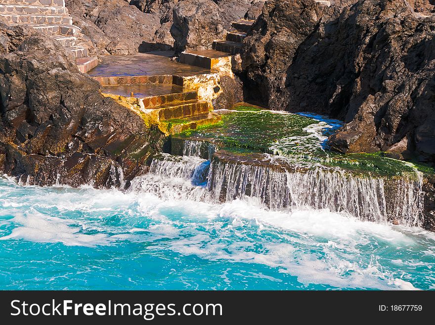 Turquoise water on stairs in Tenerife. Turquoise water on stairs in Tenerife