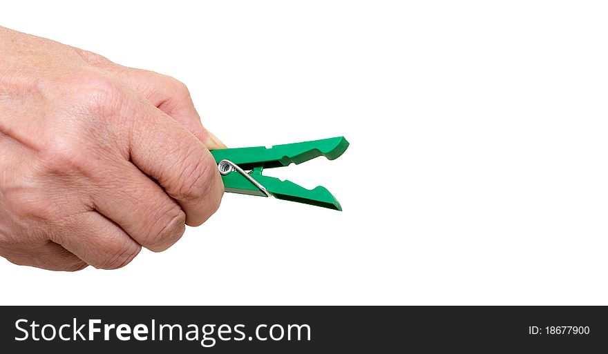 Hand with a green clothespins closeup on white background. Hand with a green clothespins closeup on white background