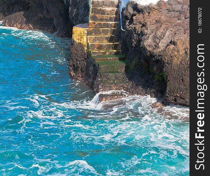 A view of steps with water on