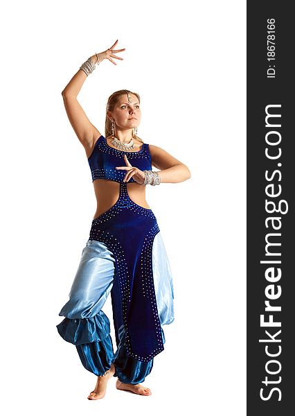 Young woman posing in arabia dance - traditional blue costume. Young woman posing in arabia dance - traditional blue costume