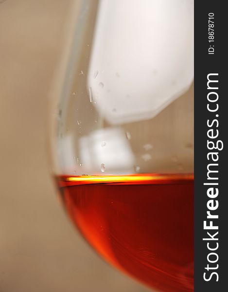 Snifter of brandy in elegant glass. black background. Snifter of brandy in elegant glass. black background