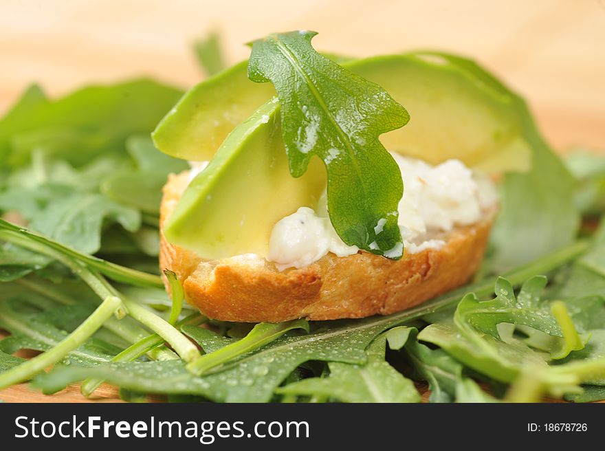 Delicious sandwich of toasted bread, avocado and spinach