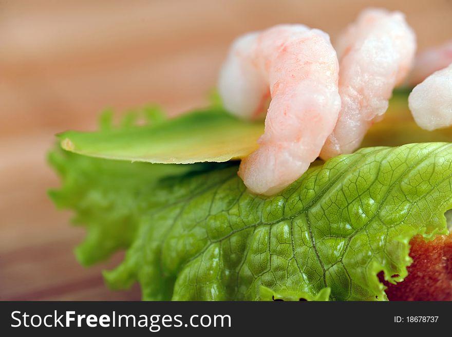 Sandwich garnish with shrimps, avokado and lettuce on  bamboo napkin, snack. Sandwich garnish with shrimps, avokado and lettuce on  bamboo napkin, snack