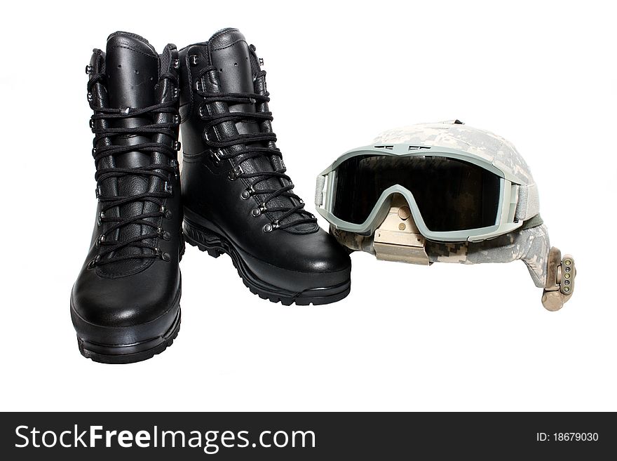 Helmet with goggles and military black boots isolated on a white background. Helmet with goggles and military black boots isolated on a white background