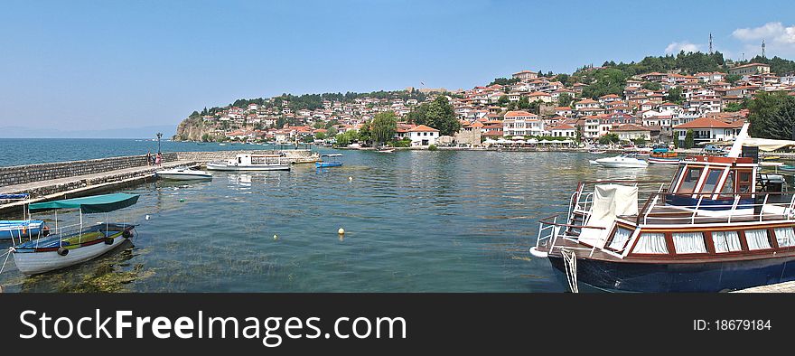 Marina  sunny day with blue sky and green grass and boats. Marina  sunny day with blue sky and green grass and boats