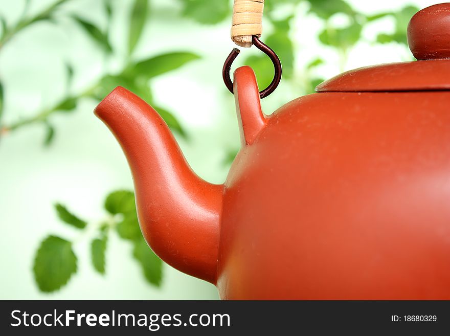 Ceramic teapot with leaves