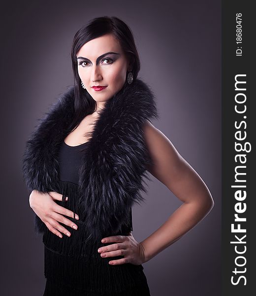 Woman in fur boa portrait - retro style make-up