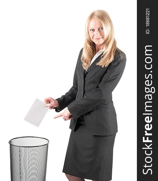 Middle aged woman casting a letter in the waste paper bin on isolated background. Middle aged woman casting a letter in the waste paper bin on isolated background