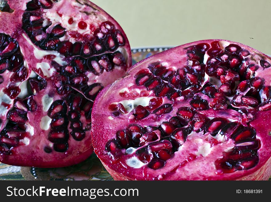 Pomegranate (Punica granatum) cut in half and in studio setting