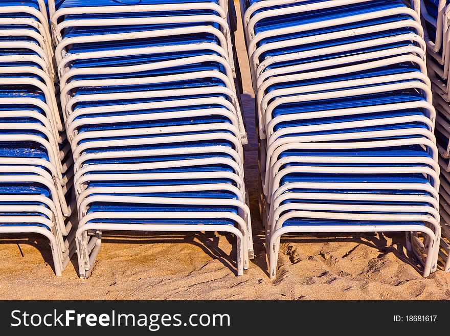 Stapled chairs at the beautiful beach. Stapled chairs at the beautiful beach