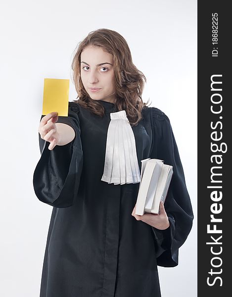 Young law school student showing a yellow card. Young law school student showing a yellow card