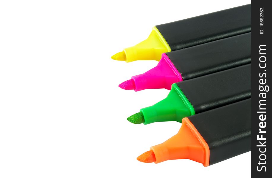 Four colorful markers isolated over white surface